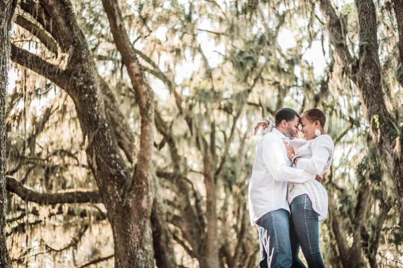 Couple under live oaks and Spanish moss